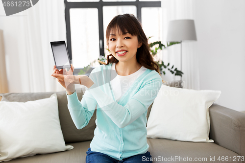 Image of female blogger makes video blog of smartphone