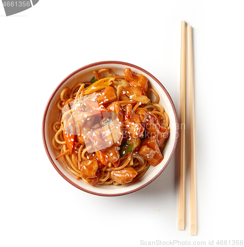 Image of freid noodles with sweet and sour pork in bowl