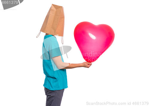 Image of Boy with paper bag over head