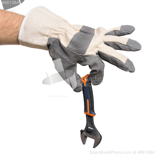 Image of Hand with glove and adjustable wrench