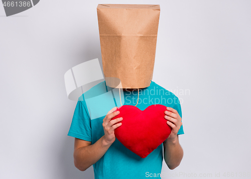 Image of Boy with paper bag over head