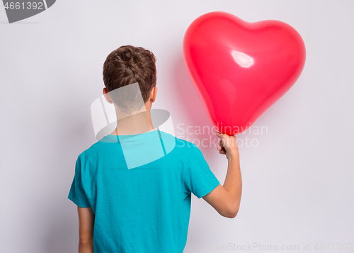 Image of Boy with heart shaped balloon