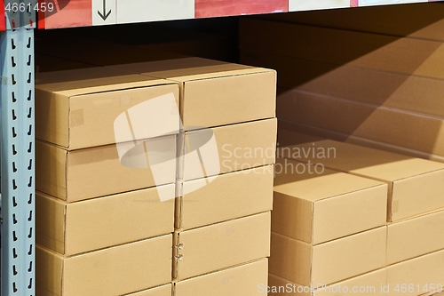 Image of Warehouse stocked with boxes in stacks