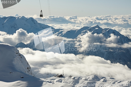 Image of Ski lift cabin in snowy mountain landscape