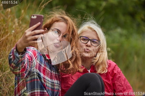 Image of Girls making faces for selfie