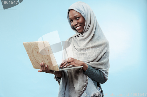 Image of Portrait Of Female University Student Working on laptop