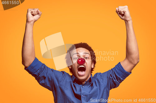 Image of Happy afro man on red nose day.