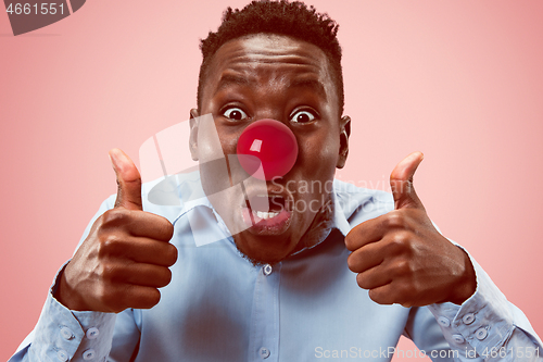 Image of Happy afro man on red nose day.