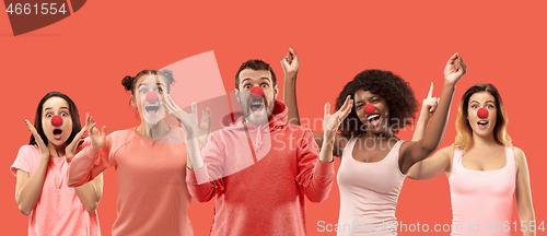 Image of The collage of faces of surprised people on coral backgrounds.