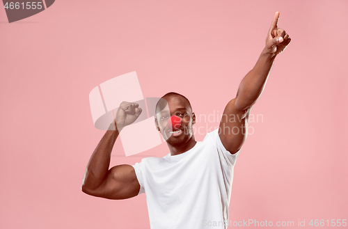 Image of Happy afro man on red nose day.