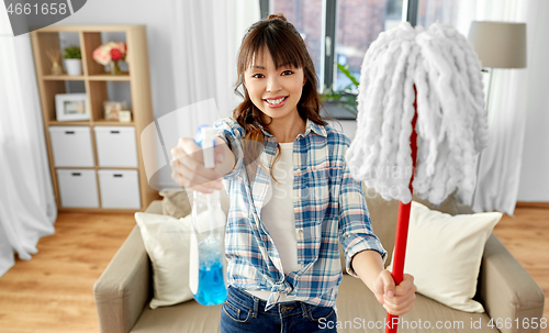 Image of asian woman with mop and detergent cleaning home