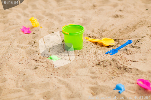 Image of bucket and sand toys on beach or in sandbox