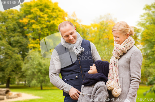 Image of happy family in autumn park