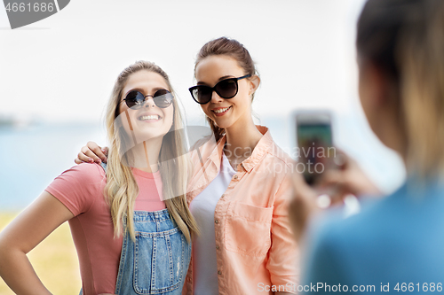 Image of teenage girls or best friends being photographed