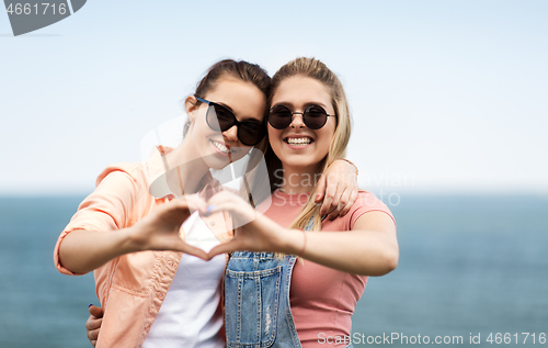 Image of teenage girls or best friends at seaside in summer