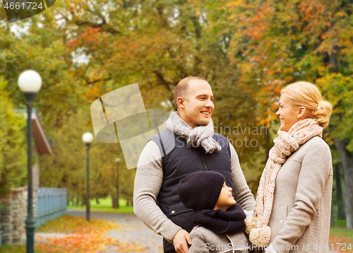 Image of happy family in autumn park