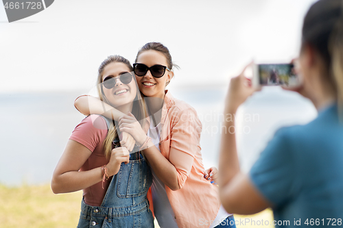 Image of teenage girls or best friends being photographed