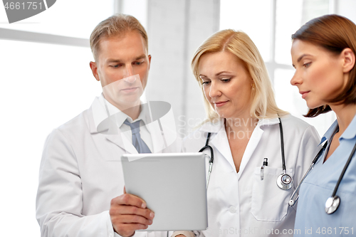 Image of group of doctors with tablet computer at hospital