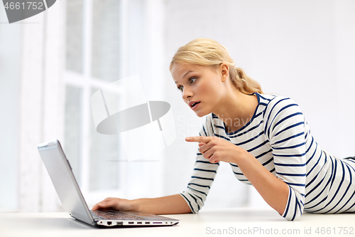 Image of woman having video call on laptop computer at home