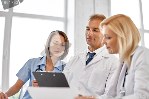 Image of group of doctors with clipboard at hospital