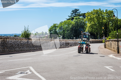 Image of MEURSAULT, BURGUNDY, FRANCE- JULY 9, 2020: Mechanical grape harvester in the Meursault streets, south west of France, Bordeaux