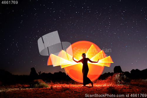 Image of Person Light Painted in the Desert Under the Night Sky