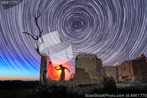 Image of Person Light Painted in the Desert Under the Night Sky