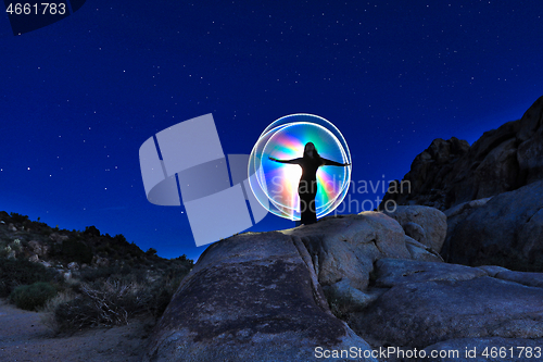 Image of Person Light Painted in the Desert Under the Night Sky