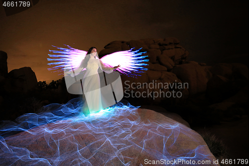 Image of Person Light Painted in the Desert Under the Night Sky