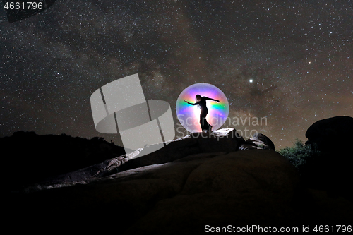 Image of Person Light Painted in the Desert Under the Night Sky