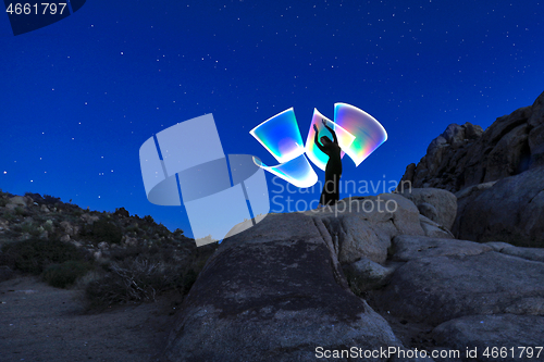 Image of Person Light Painted in the Desert Under the Night Sky