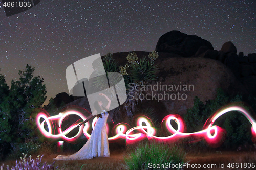 Image of Person Light Painted in the Desert Under the Night Sky