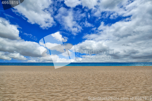 Image of Empty Beach Shot with Sky Clouds and Sand in Maui Hawaii