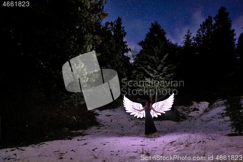 Image of Person Light Painted in the Desert Under the Night Sky