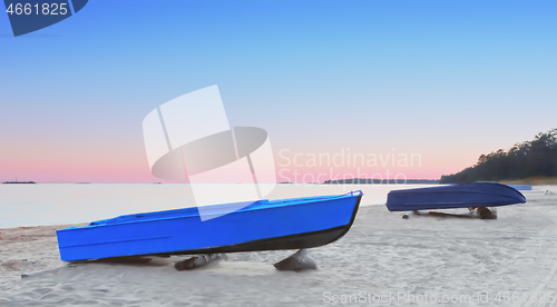 Image of Fishing Boats On The Beach At Pink Sunset