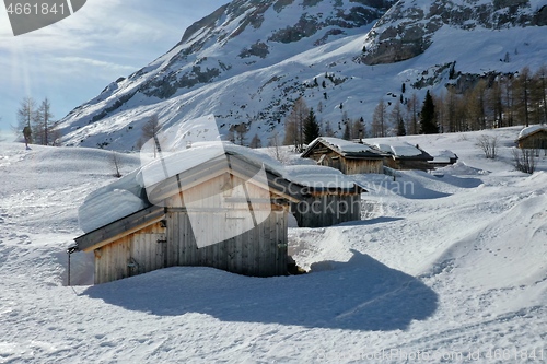 Image of aerial snow covered mountain peaks in alps at winter 