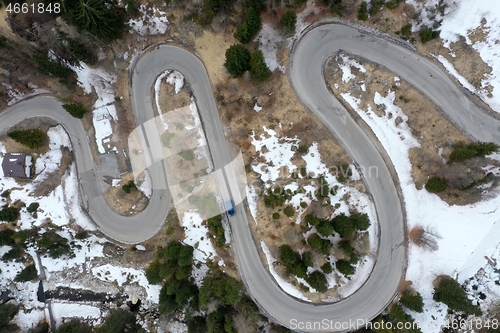 Image of alpine curvy road on winter top view