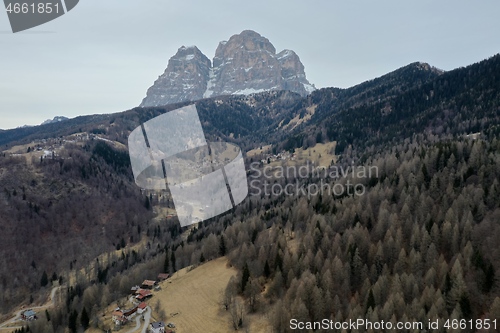 Image of aerial snow covered mountain peaks in alps at winter 