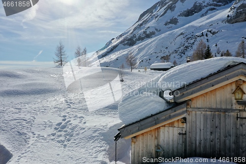 Image of aerial snow covered mountain peaks in alps at winter 