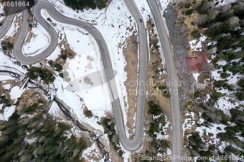 Image of alpine curvy road on winter top view