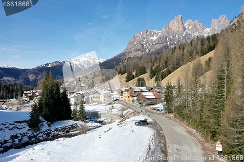 Image of aerial snow covered mountain peaks in alps at winter 