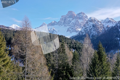 Image of aerial snow covered mountain peaks in alps at winter 