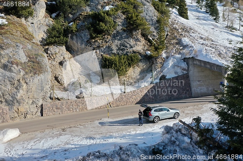 Image of aerial snow covered mountain peaks in alps at winter 