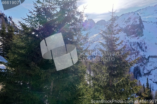 Image of aerial snow covered mountain peaks in alps at winter 