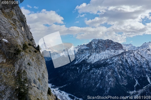 Image of aerial snow covered mountain peaks in alps at winter 