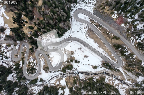 Image of alpine curvy road on winter top view