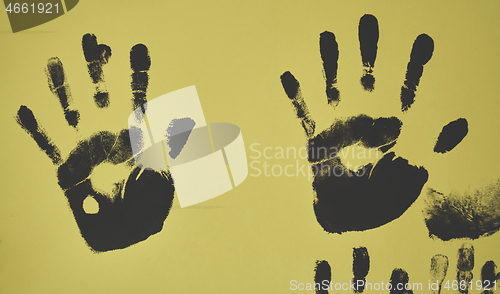 Image of creative children black handprints painting