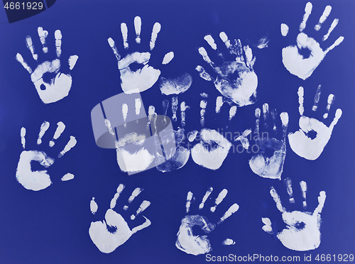 Image of creative children black handprints painting