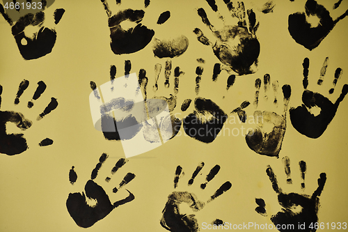 Image of creative children black handprints painting