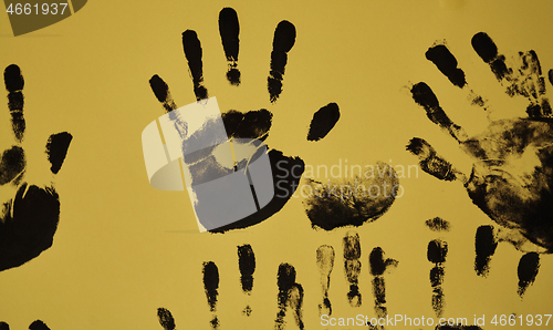 Image of creative children black handprints painting